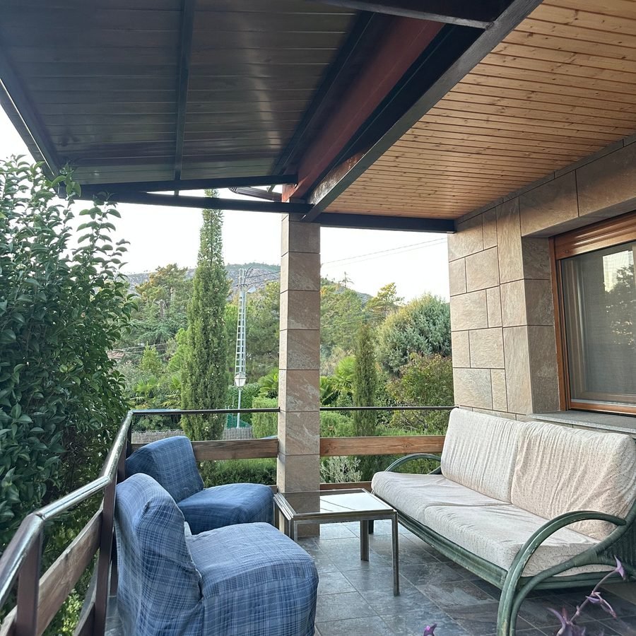 Chill-out porch with sofas and garden views