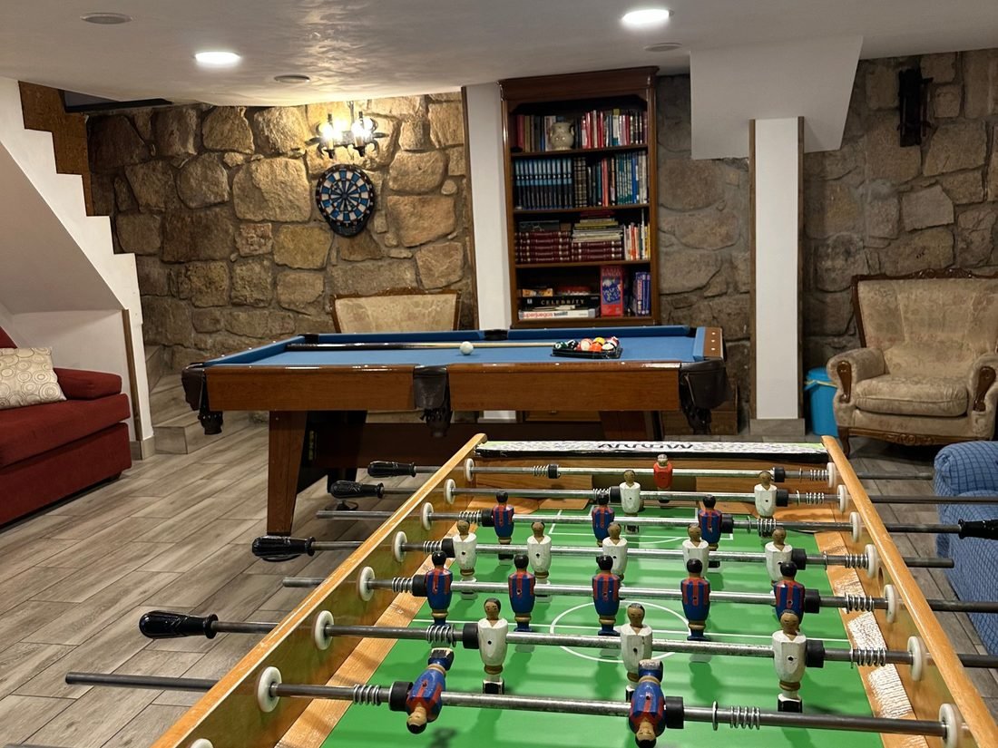 Games room with pool table, table football and darts