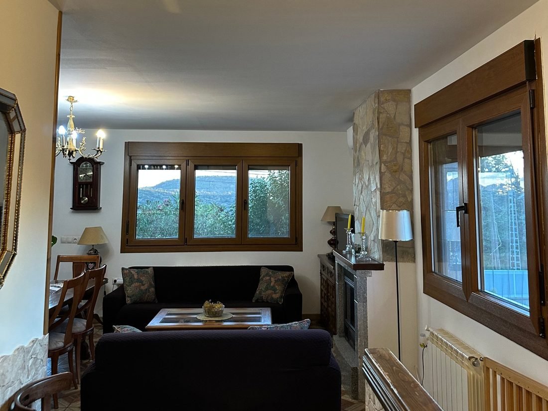 Living room with fireplace and mountain views